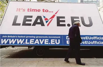  ?? AFP PIC ?? A man walking past a Brexit campaign poster in London recently. Mutual cooperatio­n will put the postBrexit fears of countries that have maintained good relations with the Unite Kingdom to rest.