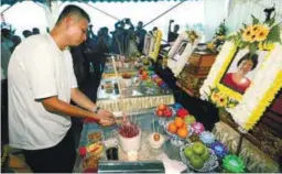  ??  ?? Lim at the wake of his family members who perished in the blaze.