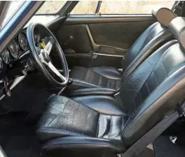  ??  ?? Above left and right: Wellworn sports seats hint at the history of this car. Steering wheel is a Nardi, shifter is a Rennshift item. Rear cage and folded Deist harnesses a hint at the car’s weekend use