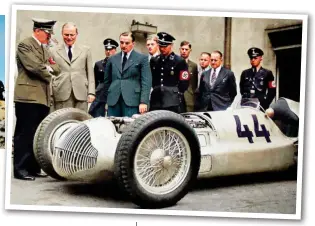  ?? ?? Right: Adolf Hitler inspecting one of the Silver Arrows race cars, developed by Mercedes and Auto Union, in 1938. They were used to showcase Nazi propaganda on the Grand Prix circuits in the 1930s