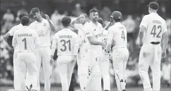  ?? ?? England players avoid an Ashes whitewash by clinging on to a draw in the just concluded fourth test against Australia. (Photo courtesy Cricket Australia)