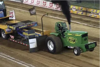  ??  ??  Winning both Friday and Saturday’s Limited Pro Stock Tractor class pulls was Justin Wagler in his Real Deere rig.