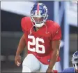  ?? Steven Senne / Associated Press ?? Giants running back Saquon Barkley steps on the field at the start of a joint practice with the Patriots on Thursday in Foxborough, Mass.