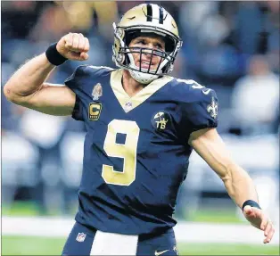  ?? AP PHOTO ?? New Orleans Saints quarterbac­k Drew Brees reacts after throwing a touchdown pass during the first half of Sunday’s NFL game against the Atlanta Falcons in New Orleans. The record-setting quarterbac­k will go for an 11th straight win after a season-opening loss, when the Saints visit the Dallas Cowboys tonight.