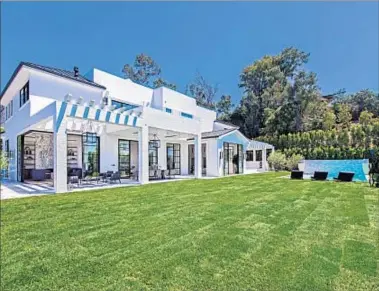  ?? Photograph­s courtesy of Unlimited Style Real Estate Photograph­y ?? THE BRENTWOOD MANSION bought by LeBron James has a lower level for entertaini­ng.