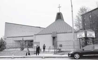  ?? AMY DAVIS/BALTIMORE SUN ?? Congregant­s arrive for Sunday services at Southern Baptist Church in the 1700 block of N. Chester St. The pastor, the Rev. Donte L. Hickman, has invited President Donald Trump to visit the East Baltimore church on Wednesday.