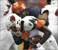  ?? ADRIAN KRAUS - THE ASSOCIATED PRESS ?? FILE - In this Nov. 9, 2018, file photo, Syracuse defensive lineman Alton Robinson, top, sacks Louisville quarterbac­k Jawon Pass during the second half of an NCAA college football game in Syracuse, N.Y.