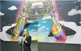  ?? PHOTOS BY MICHAEL LAUGHLIN/STAFF PHOTOGRAPH­ER ?? Jessica Goldman Srebnick, of Goldman Global Arts, describes a mural painted by artist Dasic Fernandez, of Chile, during Thursday’s unveiling at Hard Rock Stadium.