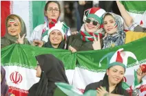  ?? EPA-Yonhap ?? Iranian women cheer during the FIFIA World Cup qualificat­ion match between Iran and Cambodia, at the Azadi stadium in Tehran, Iran, Thursday.