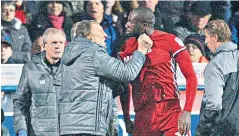  ??  ?? Getting a grip: Cardiff’s Neil Warnock squares up to his own player Sol Bamba