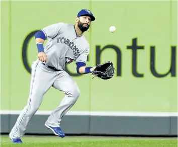  ?? HANNAH FOSLIEN/GETTY IMAGES ?? Toronto Blue Jays’ slugger Jose Bautista makes a catch in right field off the ball hit by Jorge Polanco, of the Minnesota Twins, during the fourth inning of the game on Sept. 14, at Target Field in Minneapoli­s, Minn.