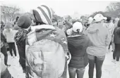  ?? SEAN DOUGHERTY-USA TODAY ?? Visitors take in the inaugurati­on from the National Mall Friday.