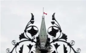  ?? ADRIAN WYLD THE CANADIAN PRESS FILE PHOTO ?? The Canadian flag flew at half mast for months after the discovery of unmarked graves at a B.C. residentia­l school last year.