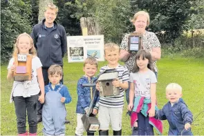  ??  ?? Excitement Some of the local children that took part in the last event of the summer activities programme, from left Stevie Anne Grant (10), Caleb McIntyre (2), Aubrey Scott (4), Hudson Scott (6), Dani Griffin (6) and Rhuben Johnstone (22 months) with Chris Martin from Perth and Kinross Council and parent Sylvia Donaldson