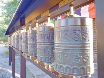  ??  ?? MORE merits by turning the Mani wheels at Kodai-ji temple
