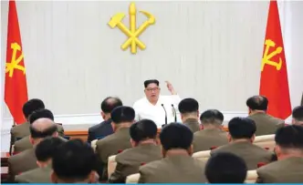  ??  ?? North Korean leader Kim Jong-Un (center) speaks while attending the first Enlarged Meeting of the 7th Central Military Commission of the Workers’ Party of Korea (WPK) in Pyongyang. — AFP