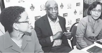  ?? RUDOLPH BROWN/PHOTOGRAPH­ER ?? Chairman of 138 Student Living Jamaica Limited, John Lee, is flanked by Company Secretary Tracey Campbell (left) and Deputy General Manager Rose Hamilton, at the company’s annual general meeting held at the Mona Visitors’ Lodge on Monday.