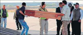  ?? AP ?? A casket with the body of one of the 39 Indian workers being loaded onto an aircraft in Baghdad on Sunday.