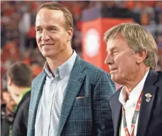  ?? KIM KLEMENT, USA TODAY SPORTS ?? Peyton Manning, left, shown with Steve Spurrier, retired after last season’s Super Bowl win capped an 18-year NFL career.