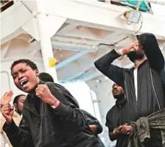  ?? Reuters ?? Migrants sing on the deck of MV Aquarius, a search and rescue ship. The vessel was headed to Spain after being banned from Italian ports.