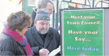  ??  ?? Penmaenmaw­r Town Councillor­s consulting the public, who agreed to pay more council tax to fund community projects