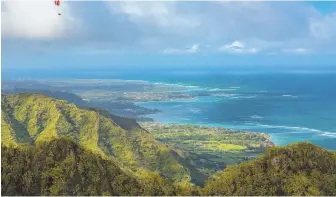  ??  ?? SURF AND TURF: Waves approach the shore along Oahu’s Windward Coast.