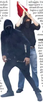  ??  ?? Il fascino total black Un momento degli scontri avvenuti ieri ad Amburgo Ansa/LaPresse