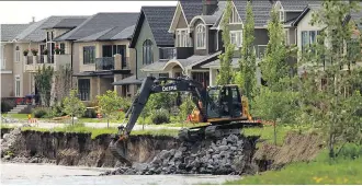  ?? LORRAINE HJALTE/ CALGARY HERALD ?? In the wake of the 2013 floods, Alberta restricted affected homeowners in floodplain­s from making disaster assistance claims in future disasters.