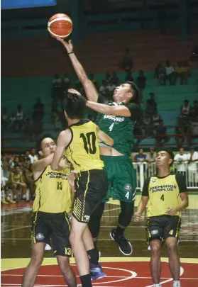  ?? SUNSTAR FOTO / ARNI ACLAO ?? D-LEAGUE BOUND. Rey Suerte had another epic performanc­e in his final tournament for the UV Green Lancers.