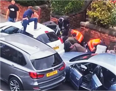  ??  ?? Cornered: Police pin Walmsley down after boxing in his car with their own vehicles