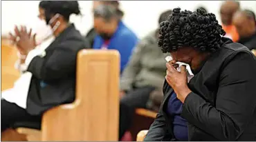  ?? SEAN RAYFORD / AP ?? Elder Sharon Hammond uses a tissue during a vigil for a group of Americans recently kidnapped in Mexico, at Word of God Ministries in Scranton, S.C. on Wednesday.