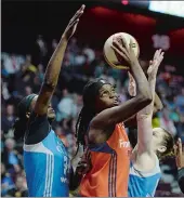  ?? SEAN D. ELLIOT THE DAY ?? Jonquel Jones, center, is fouled by Minnesota’s Lindsay Whalen, right, as Sylvia Fowles, left, helps on defense in the first half of WNBA action on May 26 at Mohegan Sun Arena.