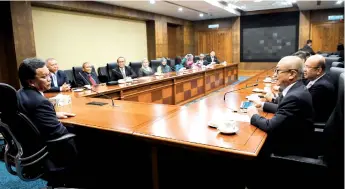  ??  ?? Shafie (left) and Rozman (two right) during a meeting with representa­tives from seven Labuan business chambers here yesterday.