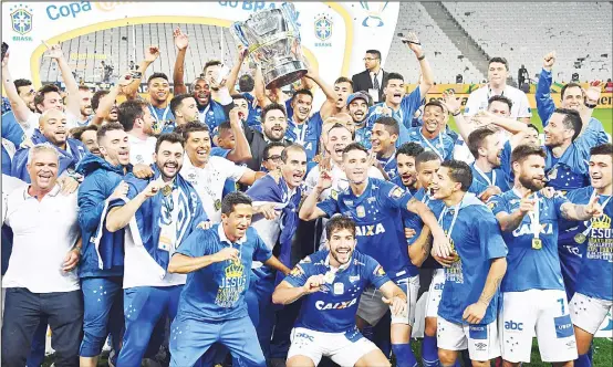  ?? (AFP) ?? Cruzeiro players celebrate after defeating Corinthian­s by penalty shots to win the Brazil Cup at Arena Corinthian­s stadium in Sao Paulo, Brazil on Oct 17.