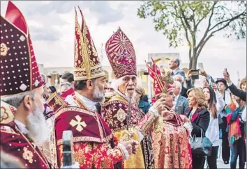  ?? Brendan Hoffman
Getty Images ?? MEMBERS OF the Armenian Apostolic Church hold a canonizati­on ceremony in Vagharshap­at, Armenia, for victims of the genocide 100 years ago. Ethnic Armenians worldwide will mark the centennial Friday.