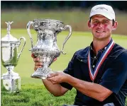  ?? USGA ?? Matt Parziale, 30 (holding the Mid-Amateur trophy with the U.S. Open trophy in the background) is a firefighte­r in Brockton, Mass.