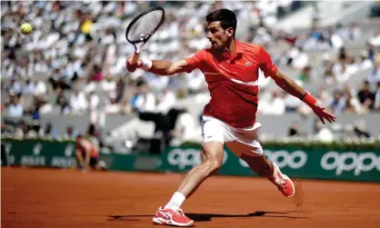  ??  ?? Novak Djokovic gets to a return during his straight-sets win over Alexander Zverev. Photograph: Yoan Valat/EPA