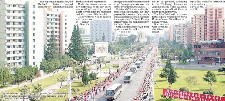  ??  ?? This photo released by North Korea’s official Korean Central News Agency (KCNA) shows buses transporti­ng nuclear weapon developers during a send-off following their stay in Pyongyang. — AFP photo