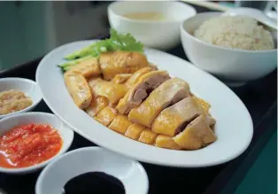  ??  ?? FOWL PLAY Oeij developed the receipe for Prive’s Hainanese chicken rice after extensive trial and error.