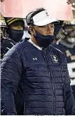  ?? AP Photo/Nick Wass ?? ■ Navy head coach Ken Niumatalol­o watches from the sidelines against Tulsa on Dec. 5 in Annapolis, Md.