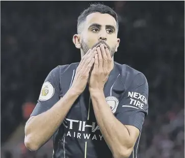  ??  ?? 0 Riyad Mahrez looks stunned after blasting a late penalty for Manchester City high over the bar.