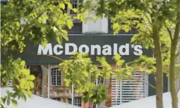  ?? MICHEL SPINGLER/AP ?? Fast-food giant McDonald’s has agreed to settle a long-running tax dispute in France. Above, a McDonald’s in the northern French town of Lille.