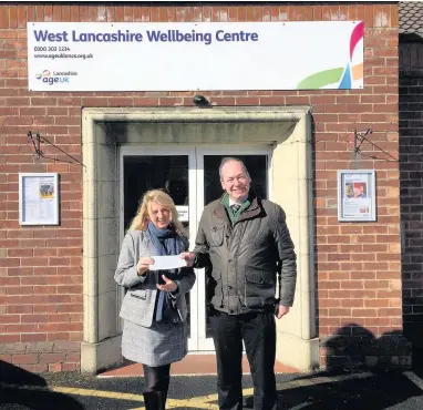  ?? Cllr Adrian Owens, who is pledging to match-fund £300, with the centre’s Donna Studholme ??