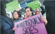  ?? SCOTT OLSON/ AFP ?? Demonstrat­ors protest outside the United Airlines terminal at O’Hare Internatio­nal Airport in Chicago on Tuesday after videos posted on social media show a passenger being dragged from his seat after he refused to leave a flight.