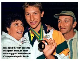  ??  ?? Ian, aged 15, with parents Margaret and Ken after winning gold at the World Championsh­ips in Perth.