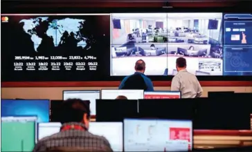  ?? WHITNEY CURTIS/THE NEW YORK TIMES ?? Employees at Mastercard’s ‘fusion centre’ in O’Fallon, Missouri, on February 16.