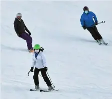  ?? CHRiS cHRiSTO PHOTOS / HeRald STaff ?? SNOW FOR THE SLOPES? People take in some runs at Ski Ward in Shrewsbury on Sunday.