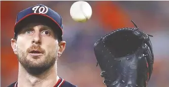  ?? EPA-Yonhap ?? Washington Nationals pitcher Max Scherzer gets the ball back after Houston Astros batter Jose Altuve hit a flyout in the bottom of the third inning of their MLB 2019 World Series game one at Minute Maid Park in Houston, Texas, Tuesday.
