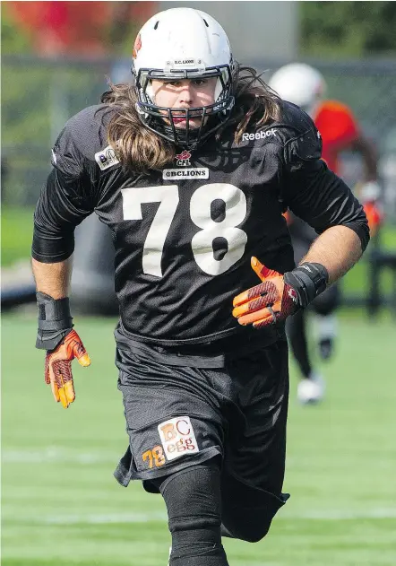  ?? RIC ERNST/PNG FILES ?? B.C. Lions defensive lineman David Menard says he’s been growing his hair for seven years and has no intention of chopping off his long locks in the foreseeabl­e future.