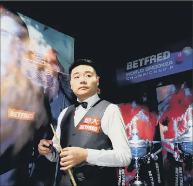  ?? PICTURE : TIM GOODE/PA WIRE ?? READY FOR BATTLE: Sheffield-based Ding Junhui gathers himself ahead of beginning his match against Barry Hawkins in the Betfred World Championsh­ip at the Crucible. Ding appears on the brink of losing with an 11-5 deficit to overhaul today.